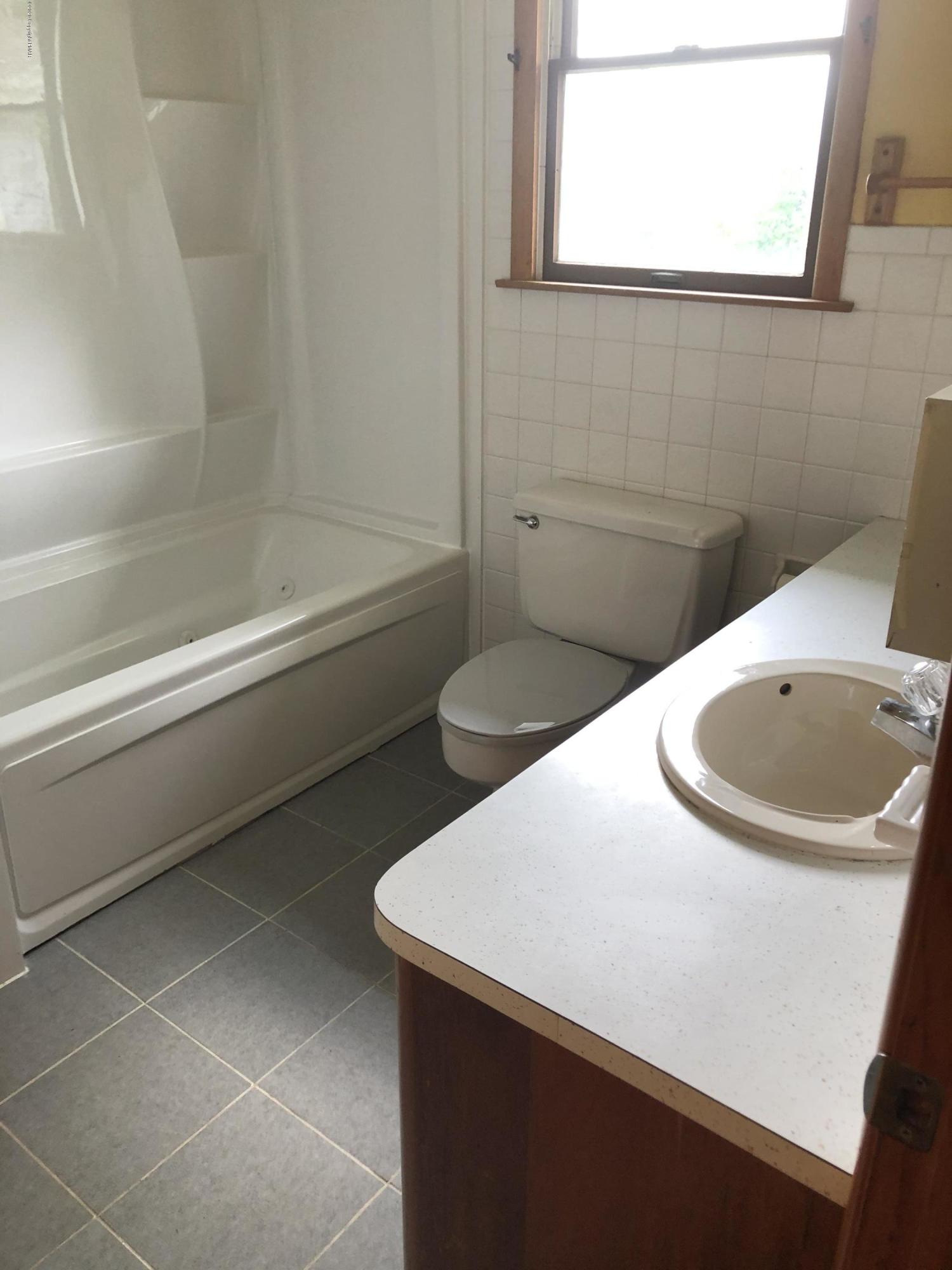 571 Spring Hill Road Moscow, PA 18444 - Photo 14 of 29 a bathroom with a sink toilet and shower