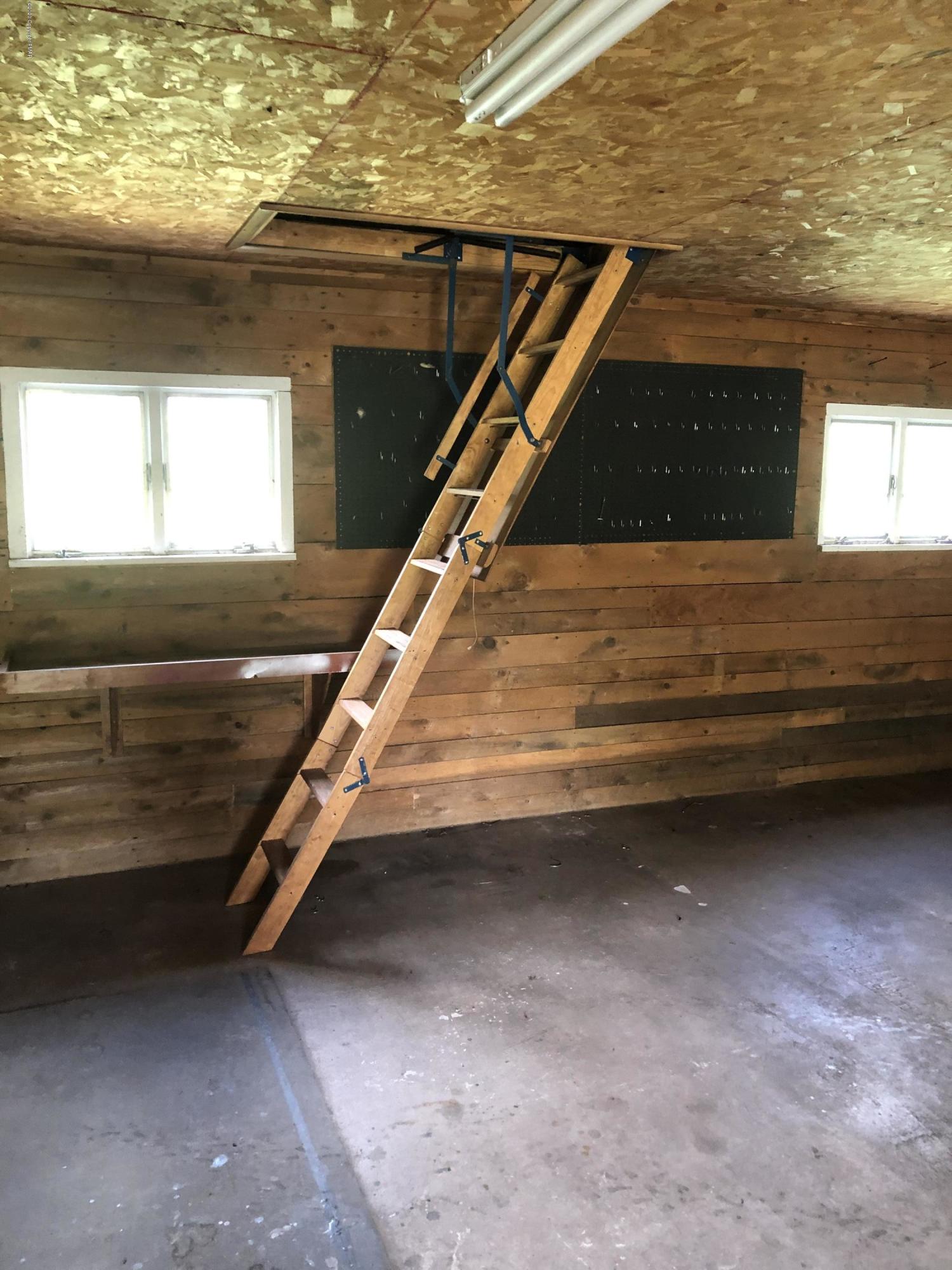 571 Spring Hill Road Moscow, PA 18444 - Photo 20 of 29 a view of room with wooden floor and window