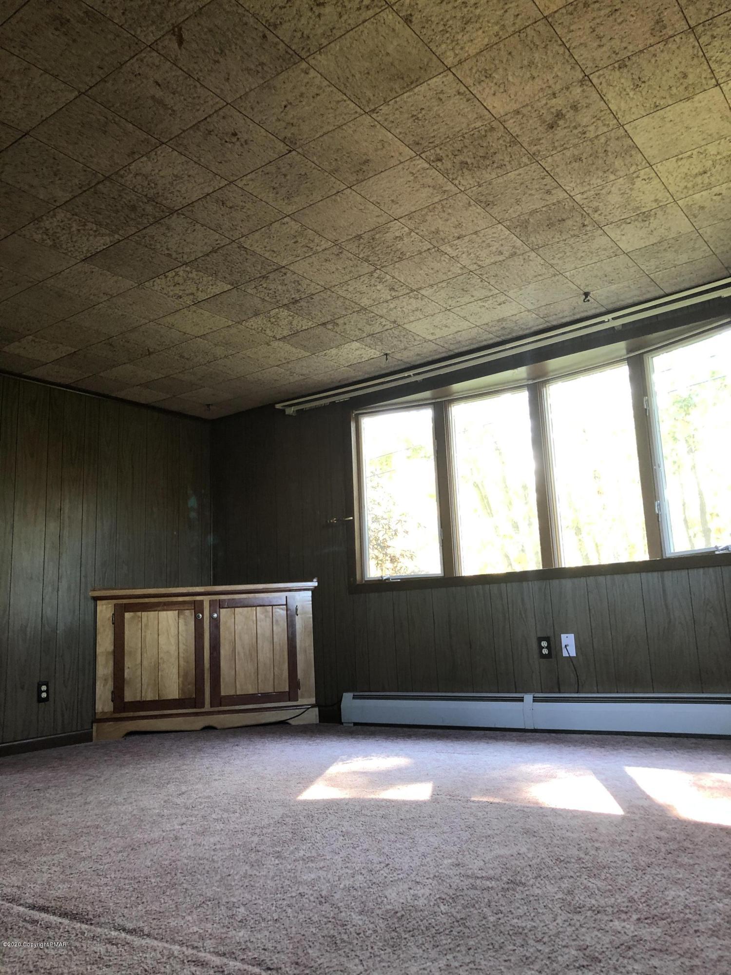 571 Spring Hill Road Moscow, PA 18444 - Photo 24 of 29 a view of an empty room with a window