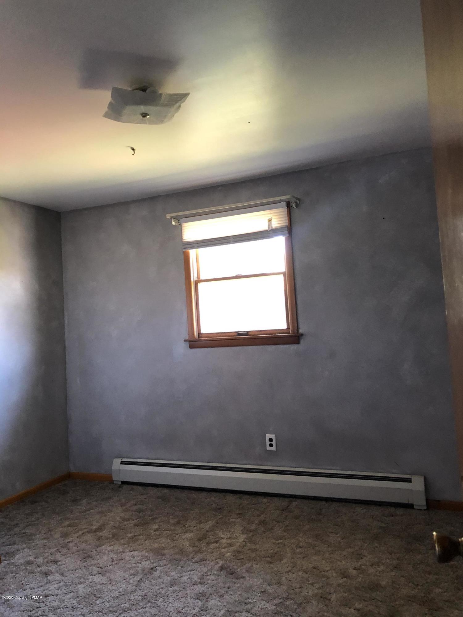 571 Spring Hill Road Moscow, PA 18444 - Photo 25 of 29 an empty room with a empty space and a window