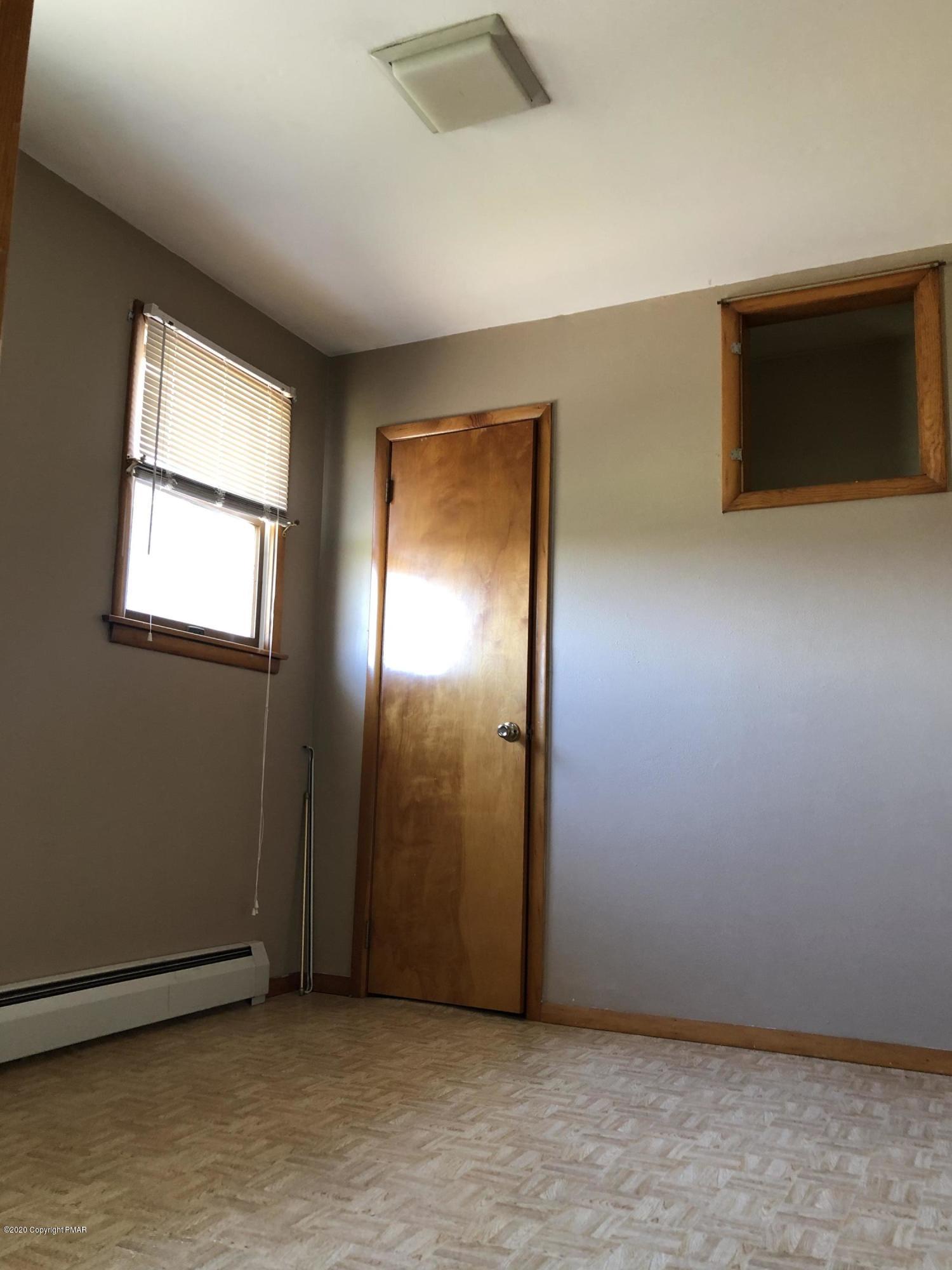 571 Spring Hill Road Moscow, PA 18444 - Photo 27 of 29 an empty room with windows and closet