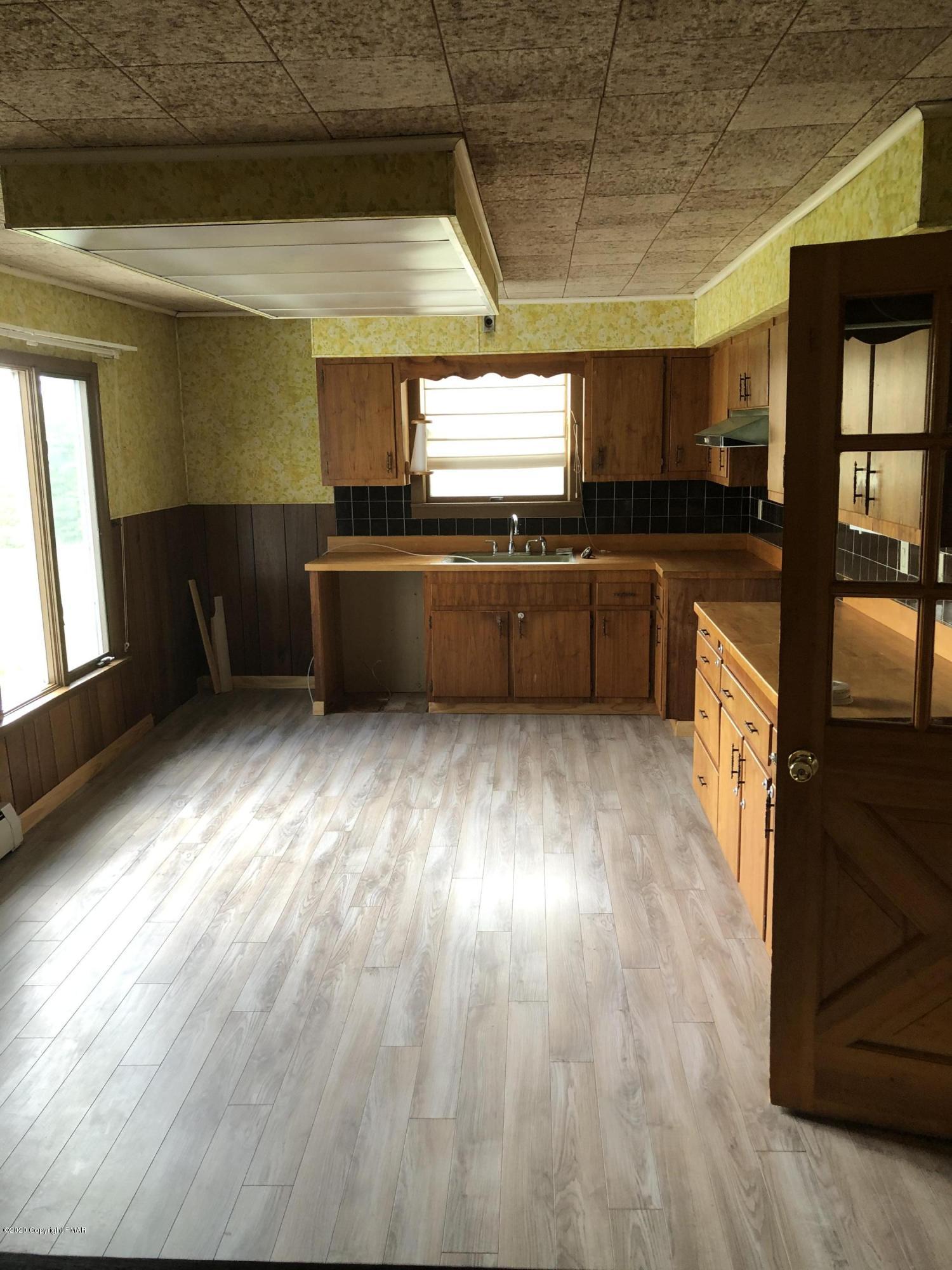 571 Spring Hill Road Moscow, PA 18444 - Photo 29 of 29 a kitchen with granite countertop lots of counter top space