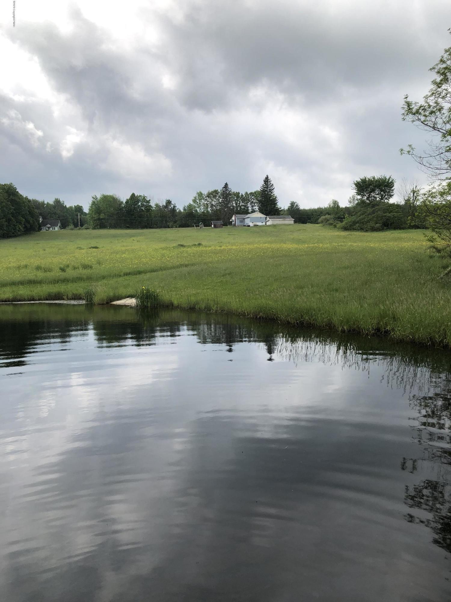 571 Spring Hill Road Moscow, PA 18444 - Photo 7 of 29 a view of a lake with houses in the back