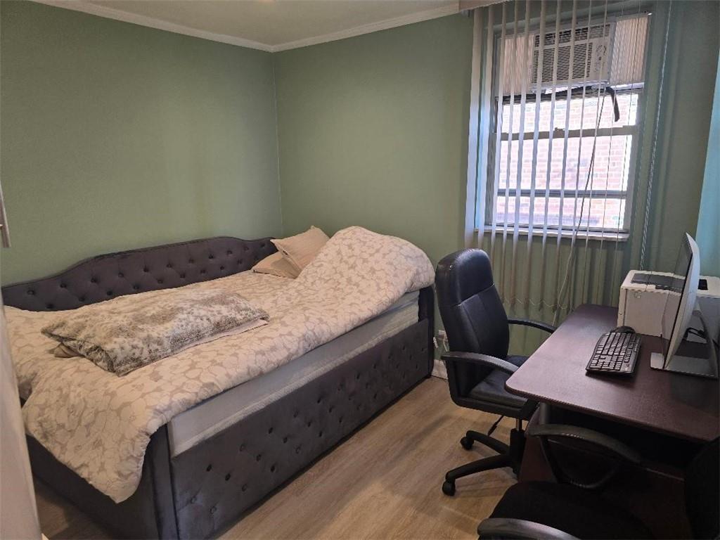 1625 Emmons Avenue, Unit 5D Brooklyn, NY 11235 - Photo 15 of 23 a bedroom with a bed and a desk