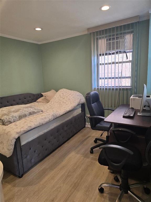 1625 Emmons Avenue, Unit 5D Brooklyn, NY 11235 - Photo 16 of 23 a bedroom with a bed and a window