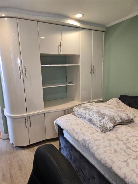 1625 Emmons Avenue, Unit 5D Brooklyn, NY 11235 - Photo 17 of 23 a bedroom with a bed and a closet