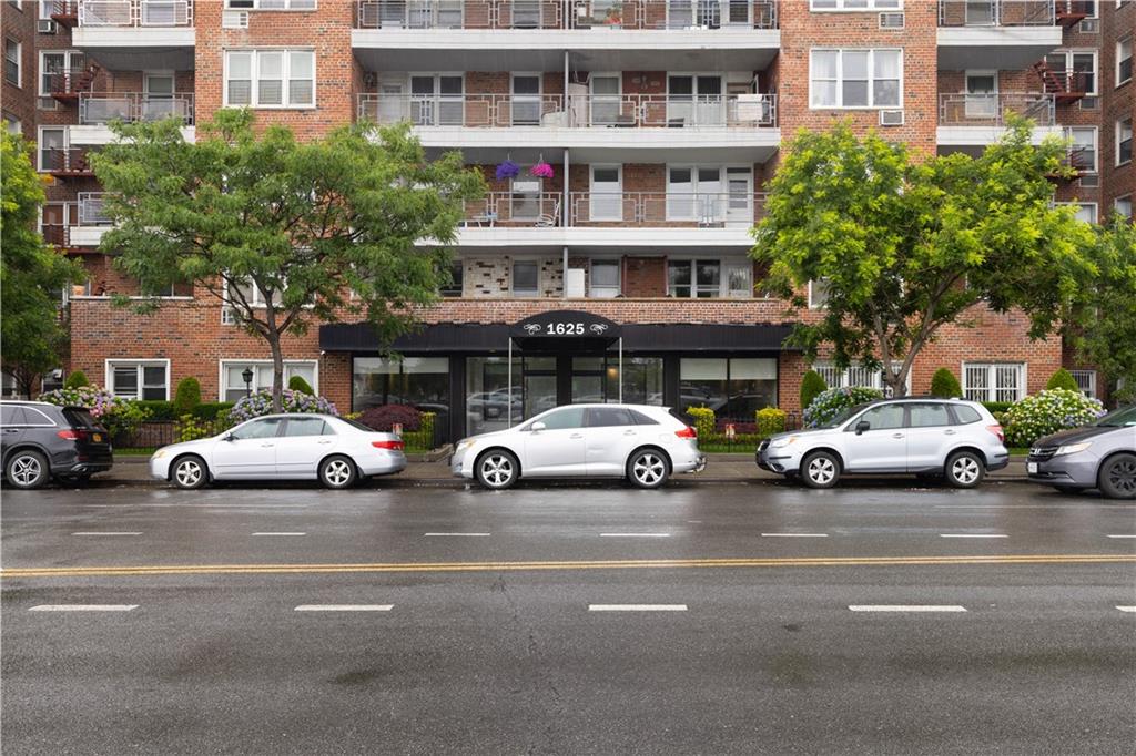 1625 Emmons Avenue, Unit 5D Brooklyn, NY 11235 - Photo 23 of 23 a view of a cars parked in front of a building