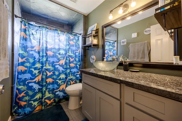 a bedroom with furniture a bed and a window