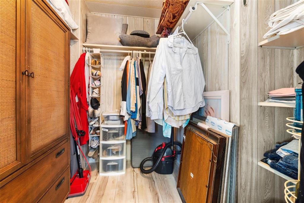 12501 Ulmerton Road, Unit 110 Largo, FL 33774 - Photo 18 of 29 a view of walk in closet with clothes and shoes
