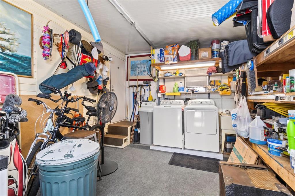 12501 Ulmerton Road, Unit 110 Largo, FL 33774 - Photo 23 of 29 a utility room with dryer and bicycles
