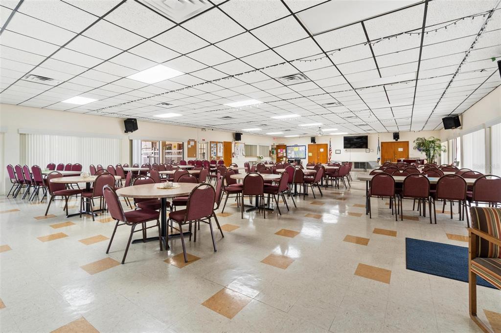 12501 Ulmerton Road, Unit 110 Largo, FL 33774 - Photo 25 of 29 a group of people sitting at tables in a room