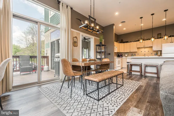 a outdoor space with lots of furniture a rug and a chandelier