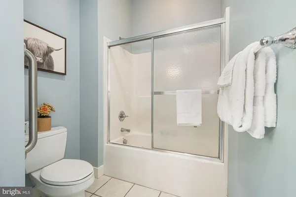 a bathroom with a shower and toilet