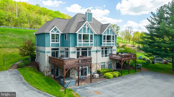 a aerial view of a house with a yard