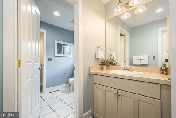 a bedroom with a bed wooden floor and window