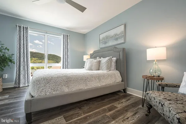 a bedroom with bed and window