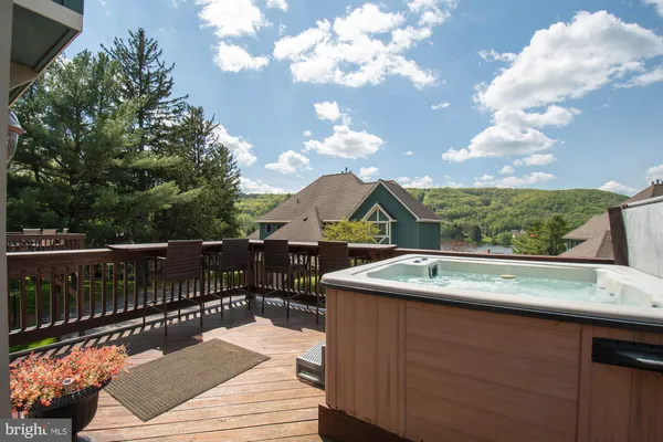 a view of a chairs and table in the balcony