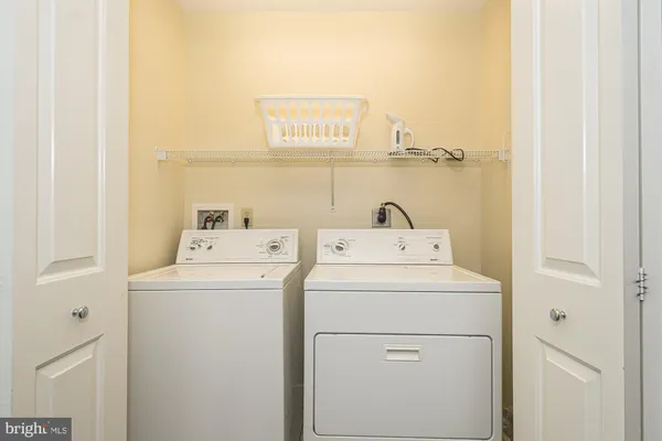 a bathroom with a sink mirror and toilet