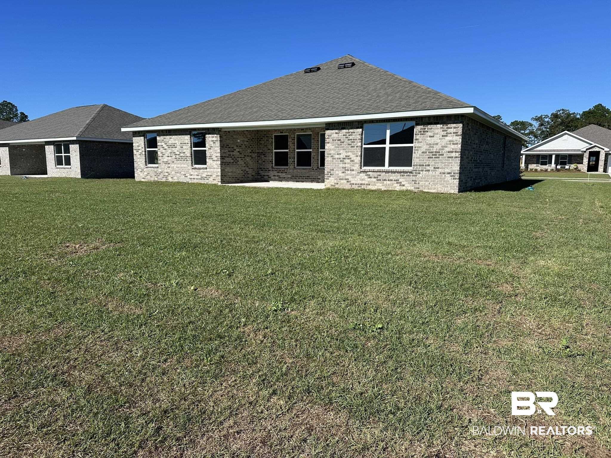 24401 Ringneck Loop Elberta, AL 36530 - Photo 3 of 3 Rear view of property with a yard
