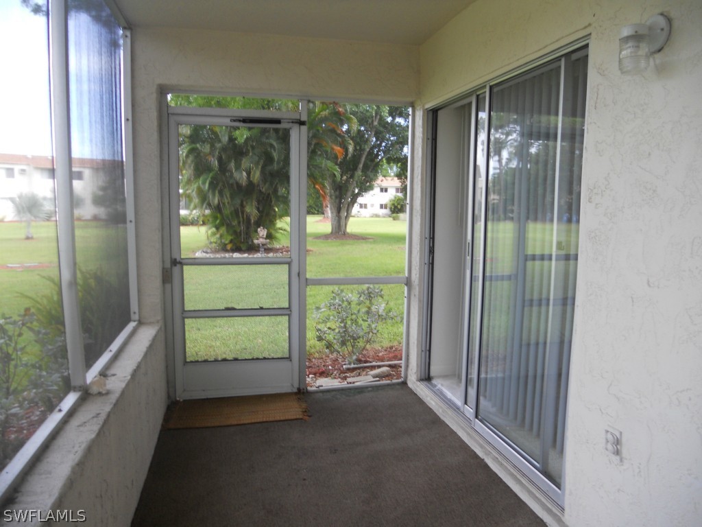 8140 County Road, Unit 102 Fort Myers, FL 33919 - Photo 6 of 16 a view of hallway with balcony