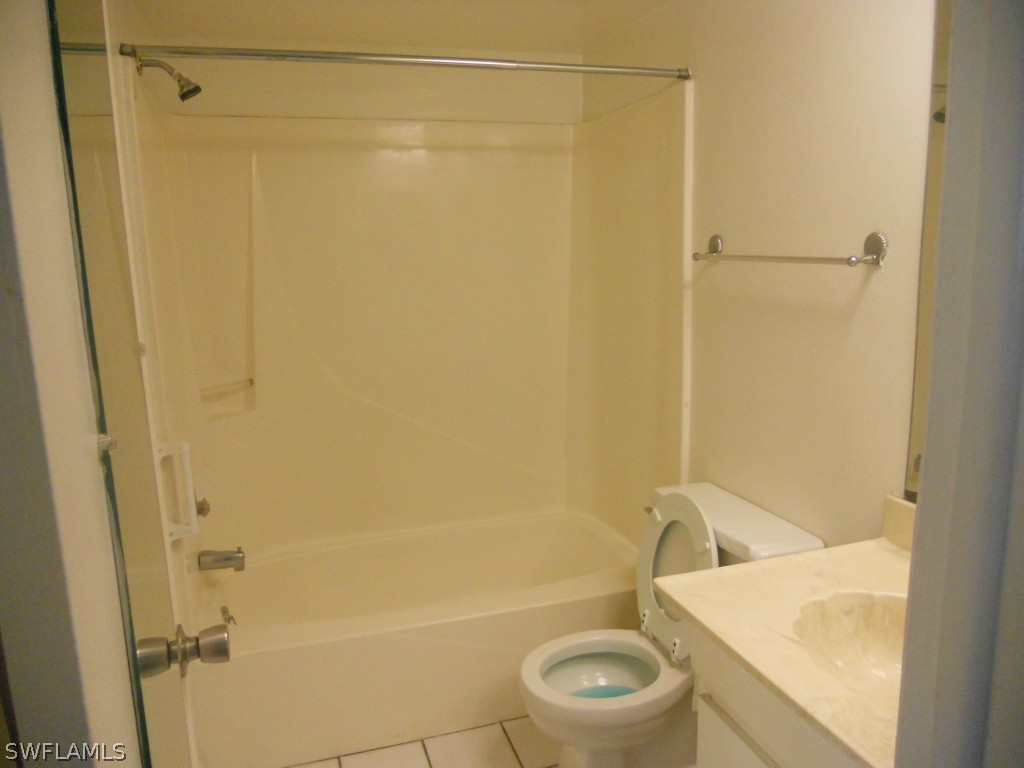 8140 County Road, Unit 102 Fort Myers, FL 33919 - Photo 10 of 16 a bathroom with a sink and a shower