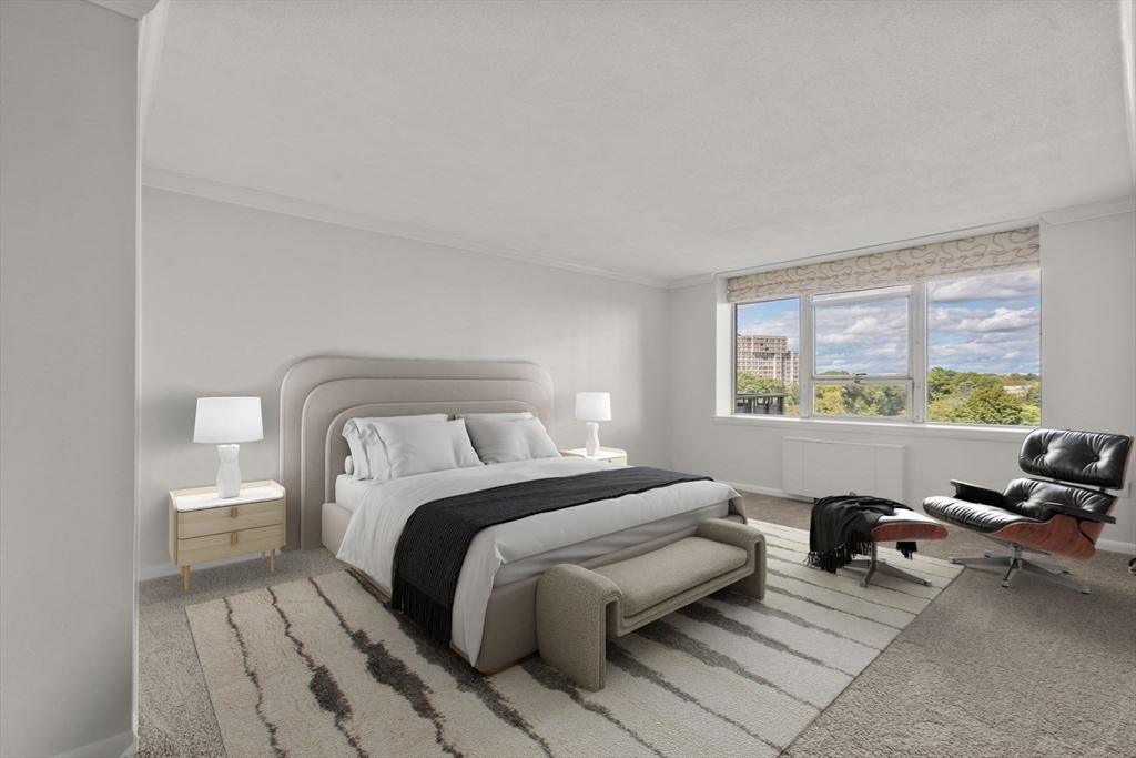 280 Boylston Street, Unit 905 Newton, MA 02467 - Photo 14 of 22 a spacious bedroom with a bed and a large window