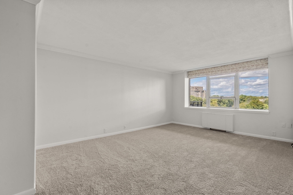 280 Boylston Street, Unit 905 Newton, MA 02467 - Photo 15 of 22 an empty room with windows