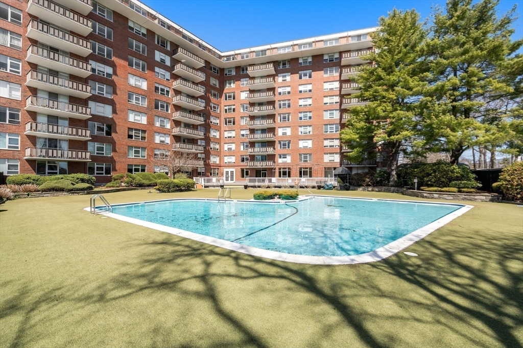 280 Boylston Street, Unit 905 Newton, MA 02467 - Photo 18 of 22 a view of a building with a swimming pool