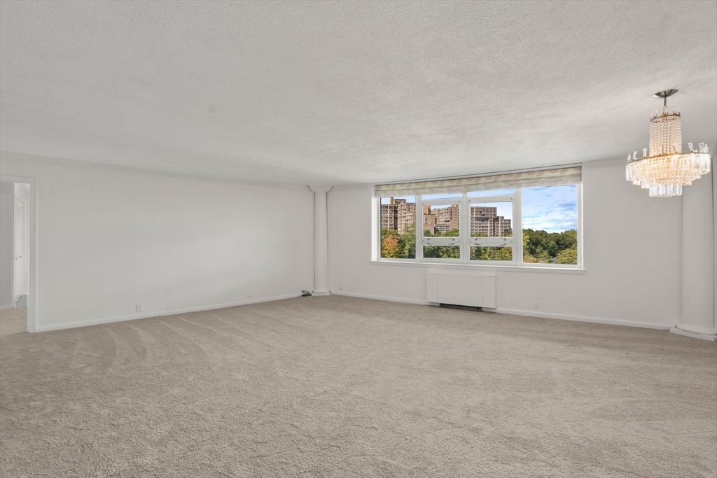 280 Boylston Street, Unit 905 Newton, MA 02467 - Photo 2 of 22 an empty room with windows
