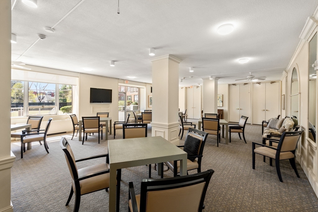 280 Boylston Street, Unit 905 Newton, MA 02467 - Photo 21 of 22 a view of a dining room with furniture