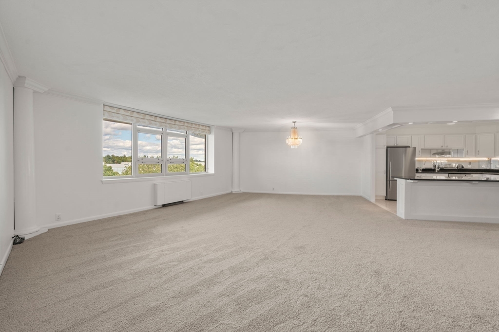 280 Boylston Street, Unit 905 Newton, MA 02467 - Photo 4 of 22 a view of an empty room with a window