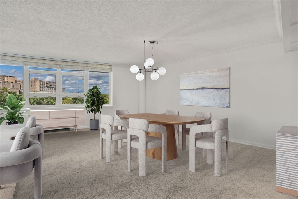 280 Boylston Street, Unit 905 Newton, MA 02467 - Photo 5 of 22 a dining room with a wooden table and chairs