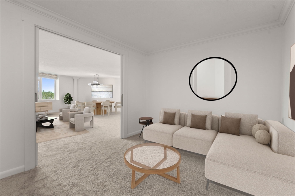 280 Boylston Street, Unit 905 Newton, MA 02467 - Photo 9 of 22 a living room with furniture a mirror and a lamp