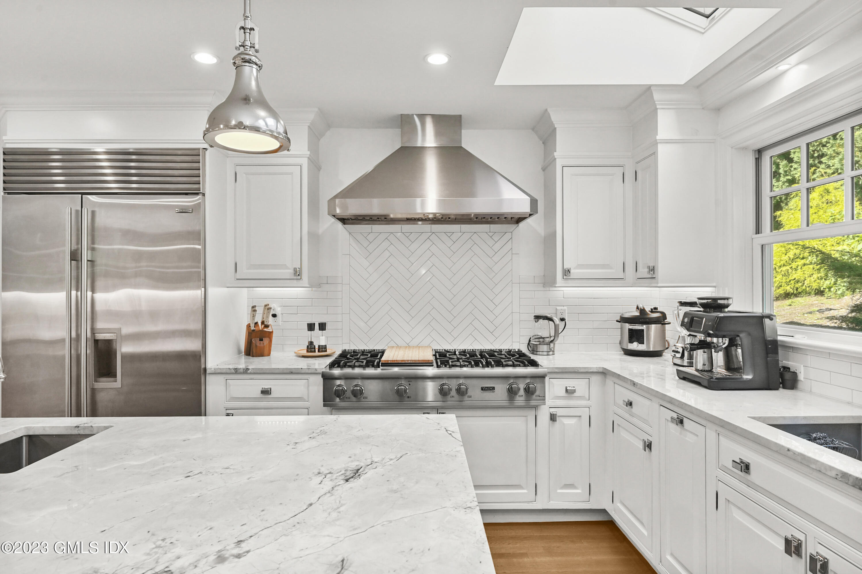 36 Evergreen Road Greenwich, CT 06830 - Photo 12 of 42 a kitchen with stainless steel appliances a stove a sink a refrigerator and cabinets