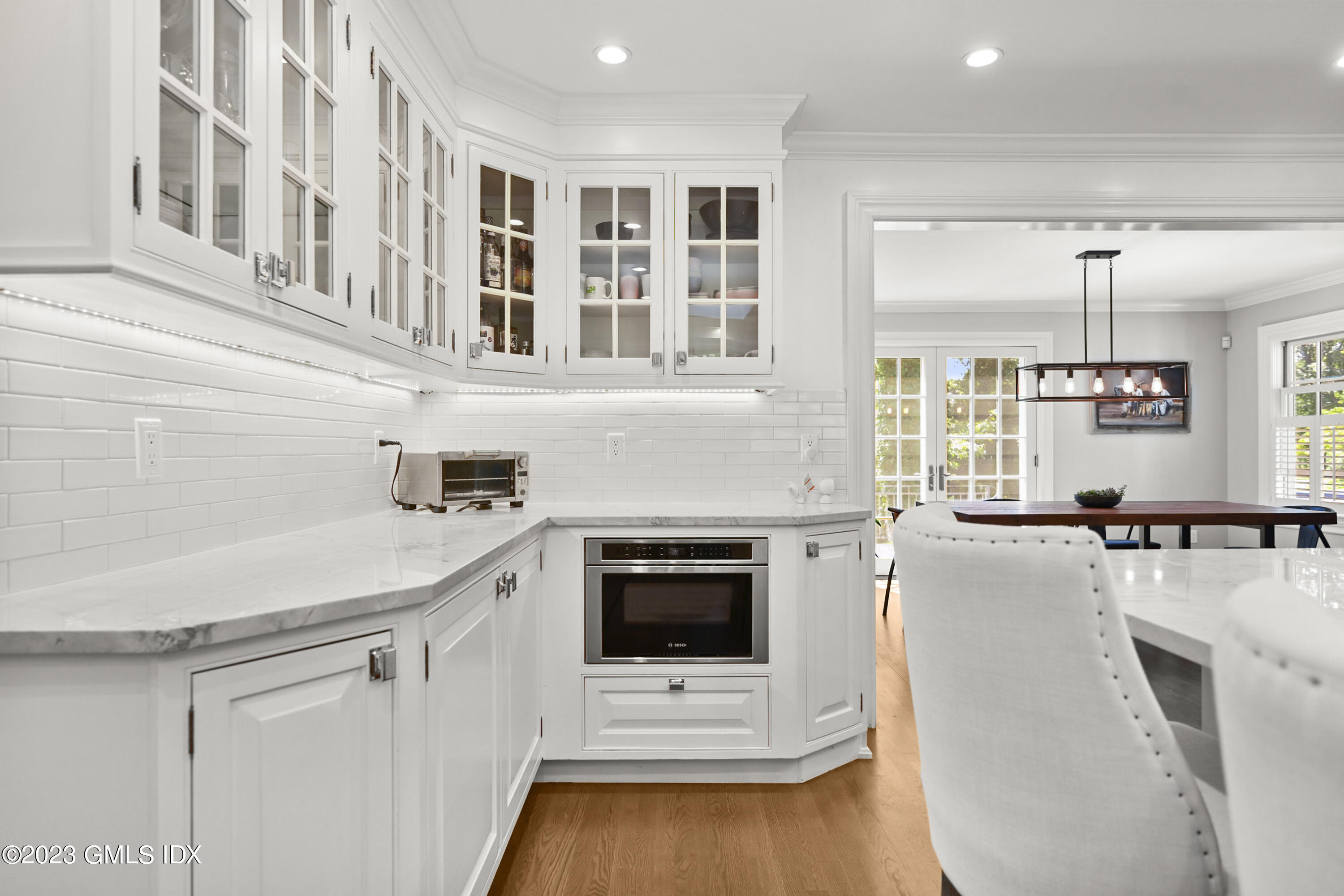 36 Evergreen Road Greenwich, CT 06830 - Photo 13 of 42 a kitchen with kitchen island a stove a sink and a refrigerator