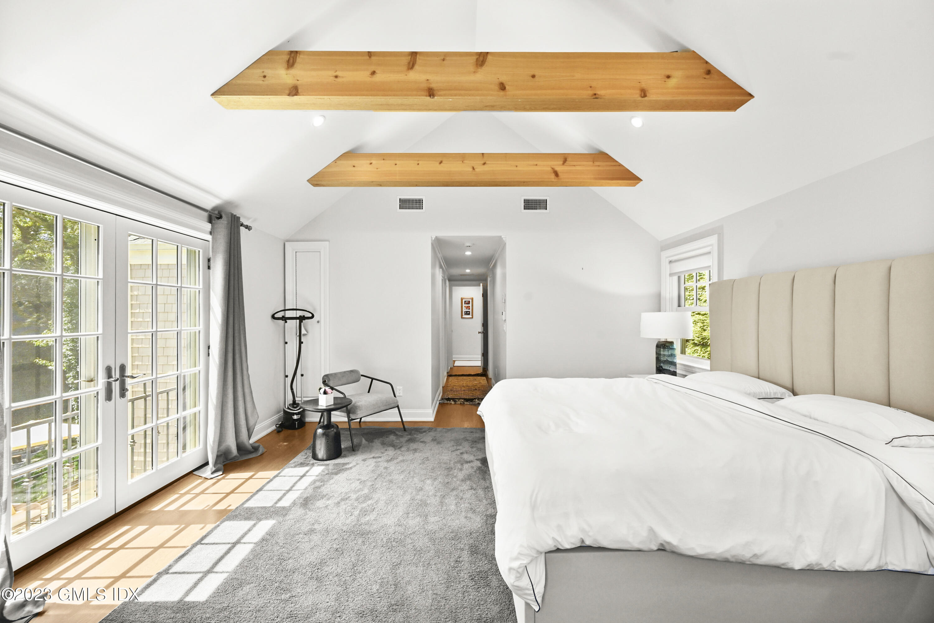 36 Evergreen Road Greenwich, CT 06830 - Photo 19 of 42 a bedroom with a bed and wooden floor