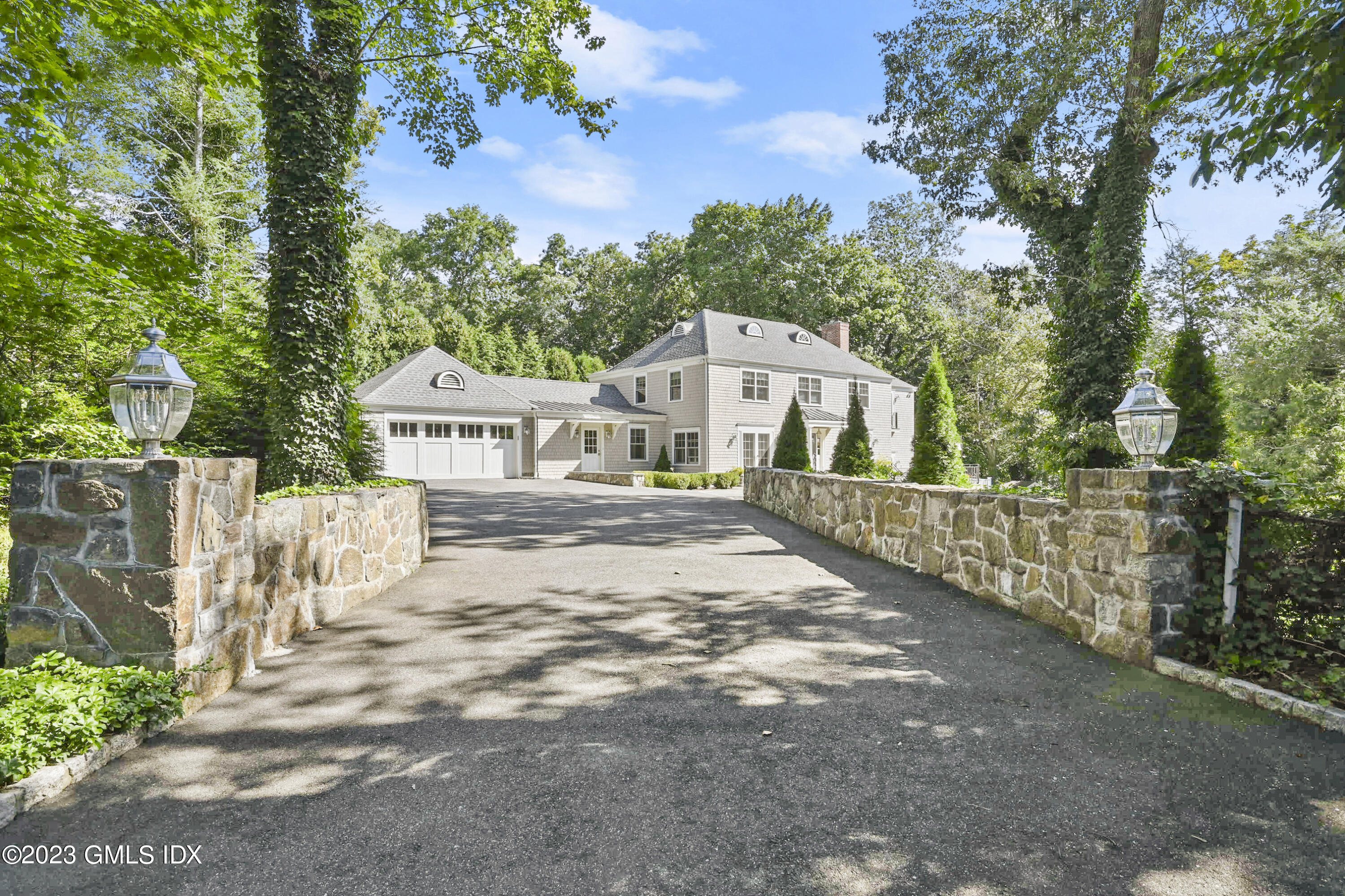 36 Evergreen Road Greenwich, CT 06830 - Photo 2 of 42 a view of a house with a yard