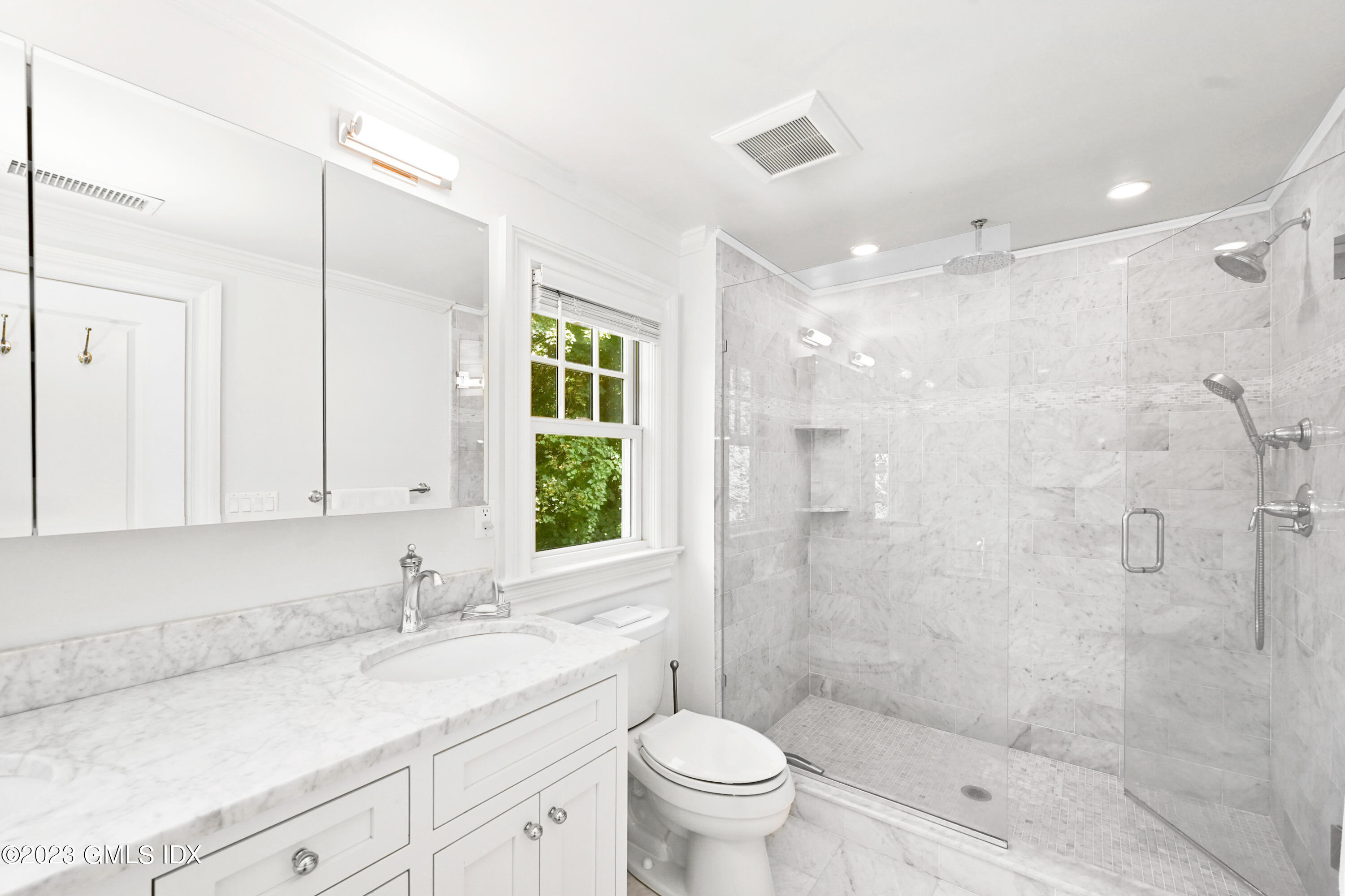 36 Evergreen Road Greenwich, CT 06830 - Photo 21 of 42 a bathroom with a shower sink vanity mirror and toilet