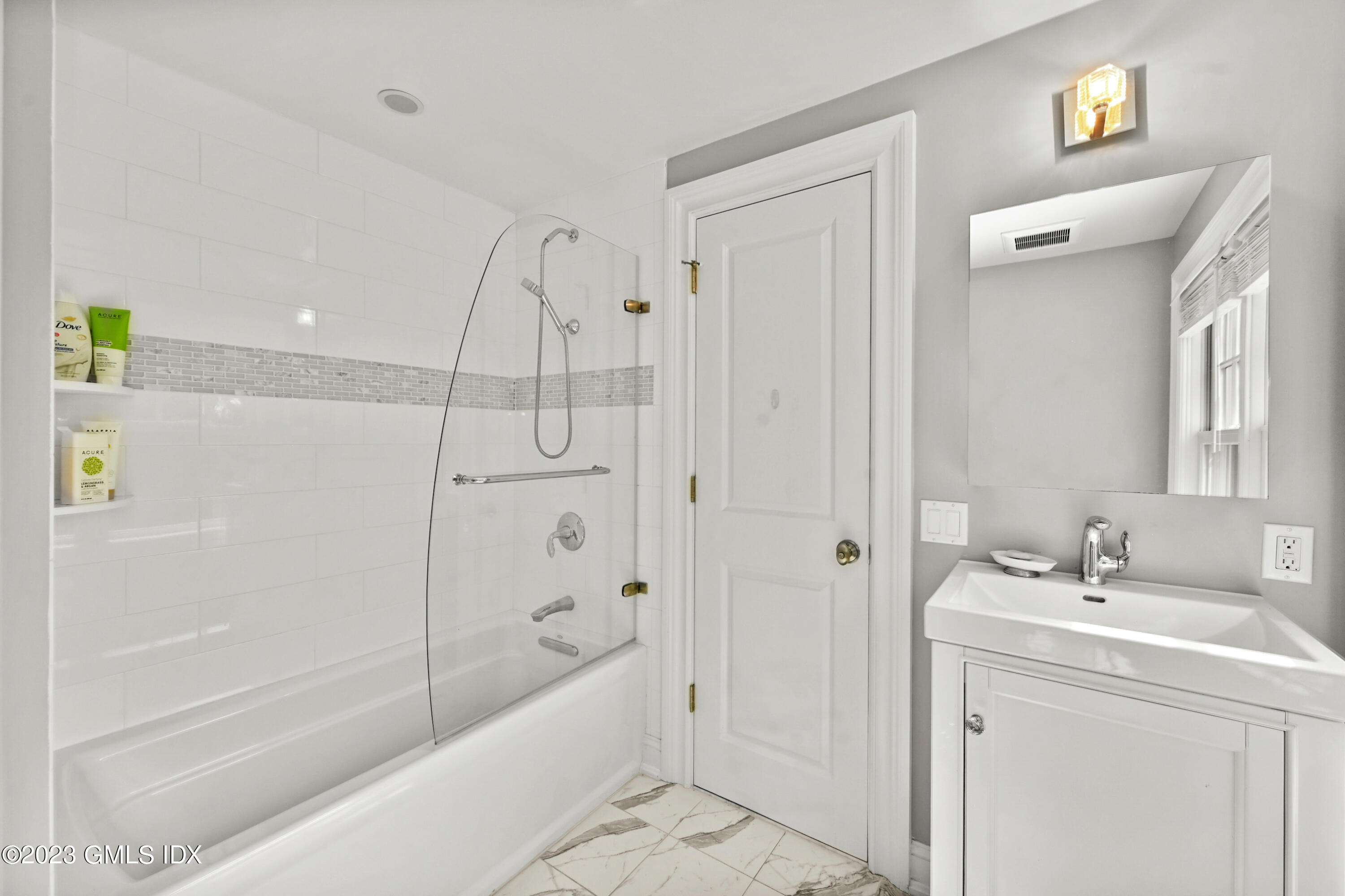 36 Evergreen Road Greenwich, CT 06830 - Photo 24 of 42 a bathroom with a bathtub a shower a sink and mirror