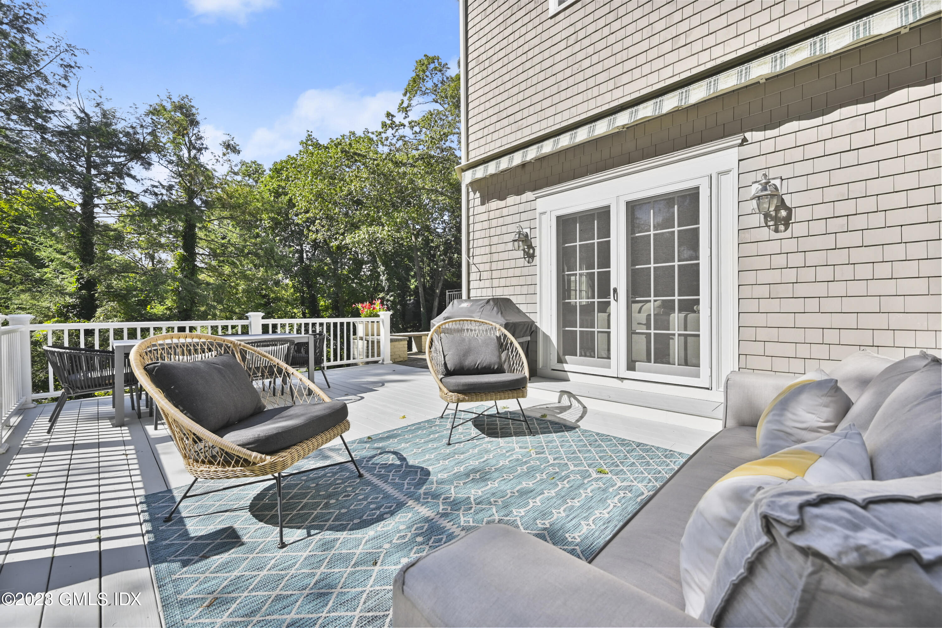 36 Evergreen Road Greenwich, CT 06830 - Photo 29 of 42 a view of a roof deck with couches and chairs