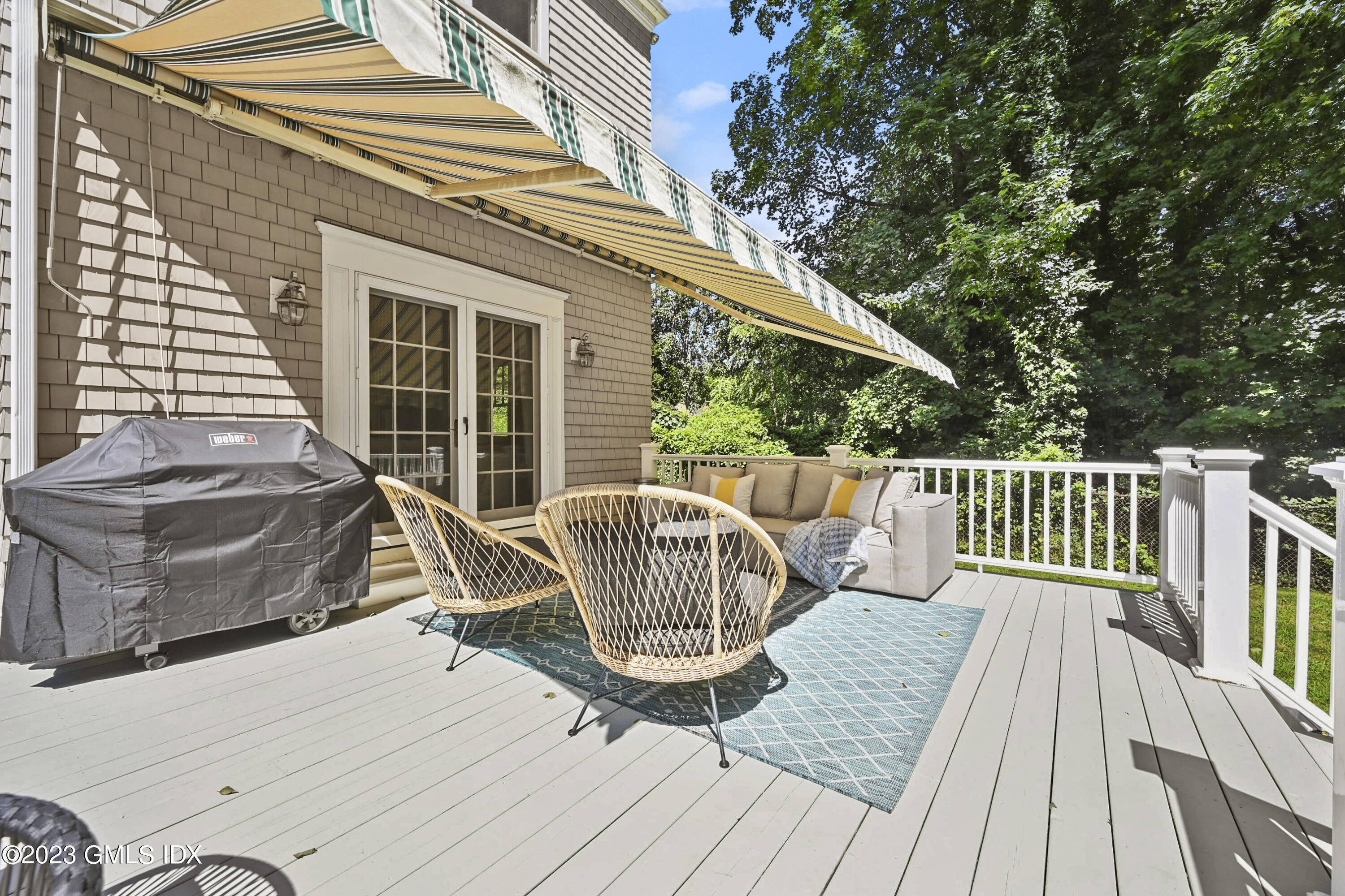 36 Evergreen Road Greenwich, CT 06830 - Photo 30 of 42 a view of a deck with two couches and wooden floor