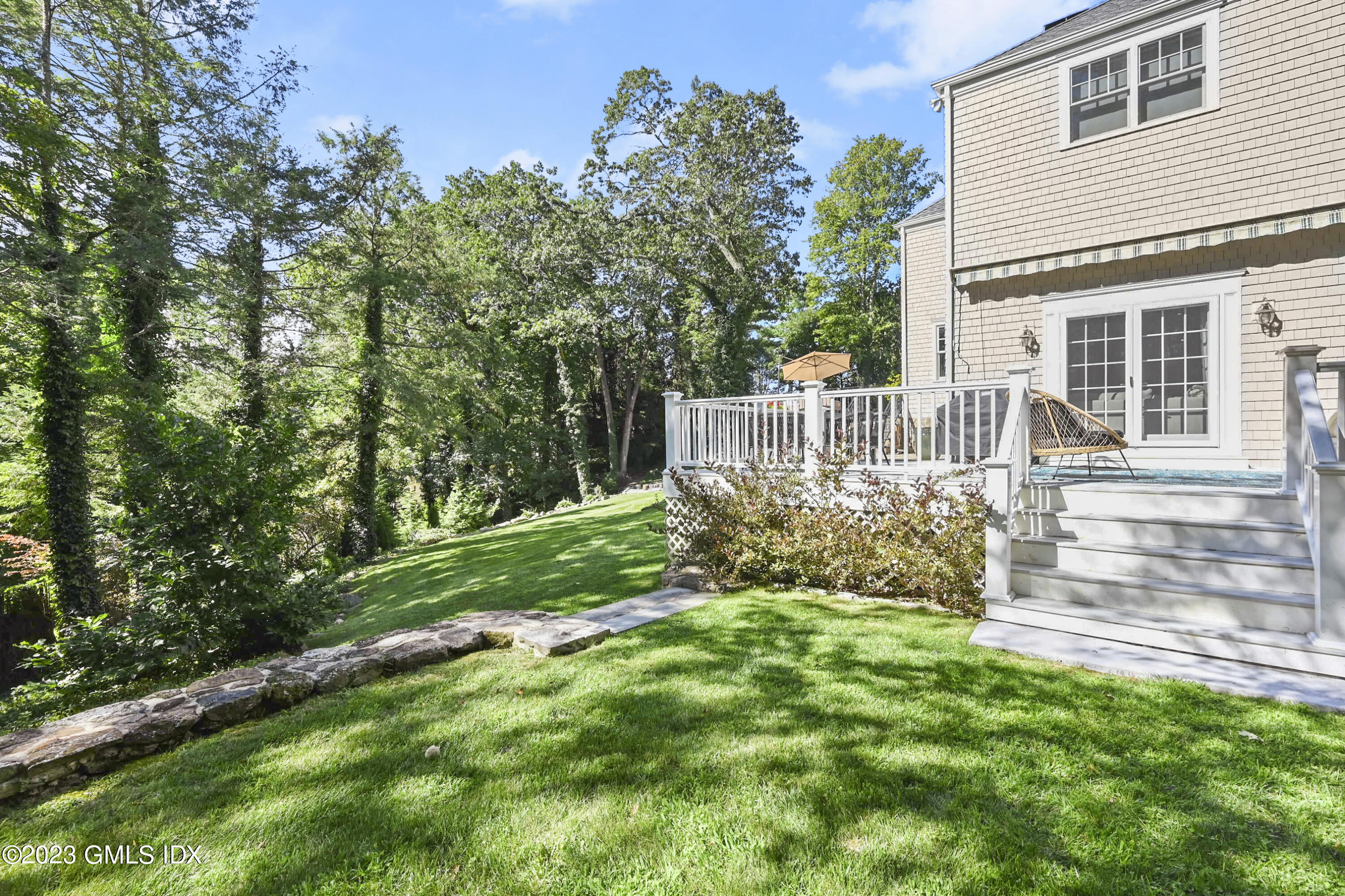 36 Evergreen Road Greenwich, CT 06830 - Photo 33 of 42 a view of a house with a yard and sitting area