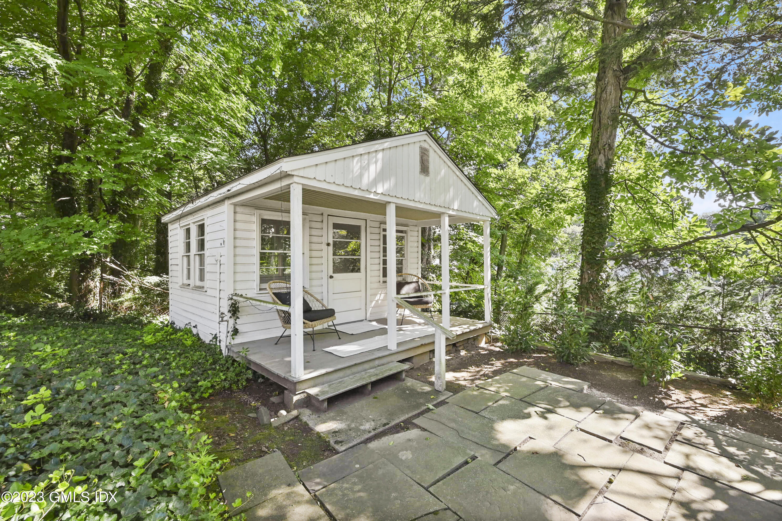 36 Evergreen Road Greenwich, CT 06830 - Photo 34 of 42 a view of a house with a yard