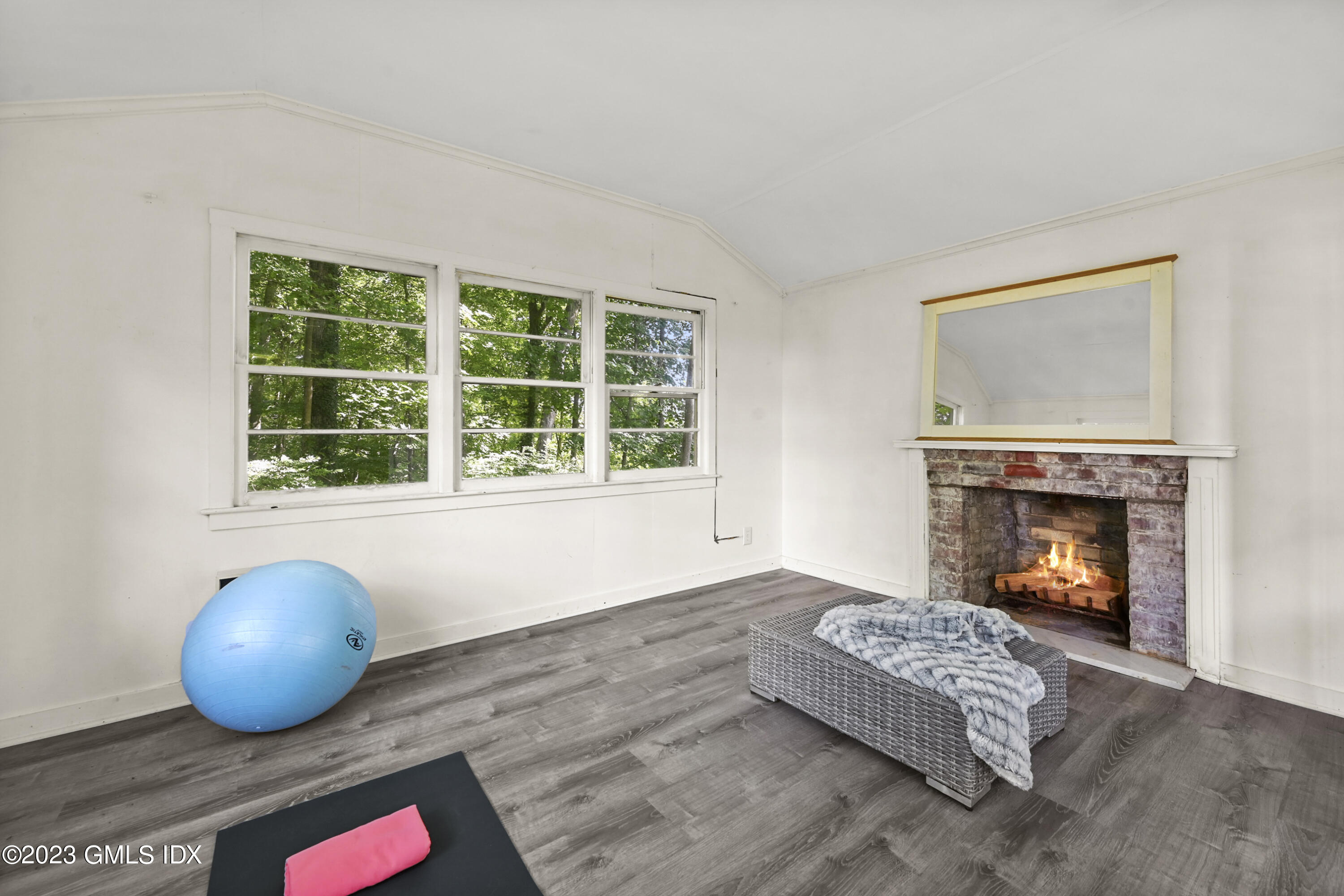 36 Evergreen Road Greenwich, CT 06830 - Photo 36 of 42 a living room with furniture and a fireplace