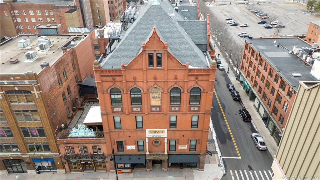 a view of a large building with a clock on the wall