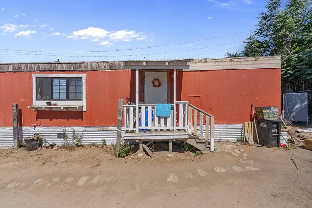 a balcony with furniture and flat screen tv