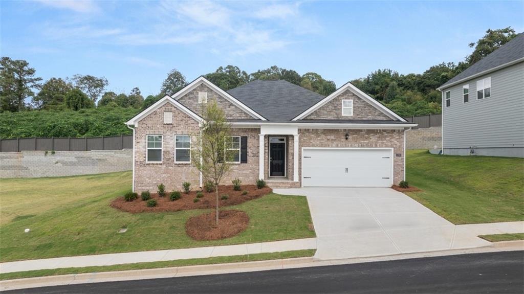 2242 Edgecombe Lane Dacula, GA 30019 - Photo 1 of 33 a front view of a house with a yard