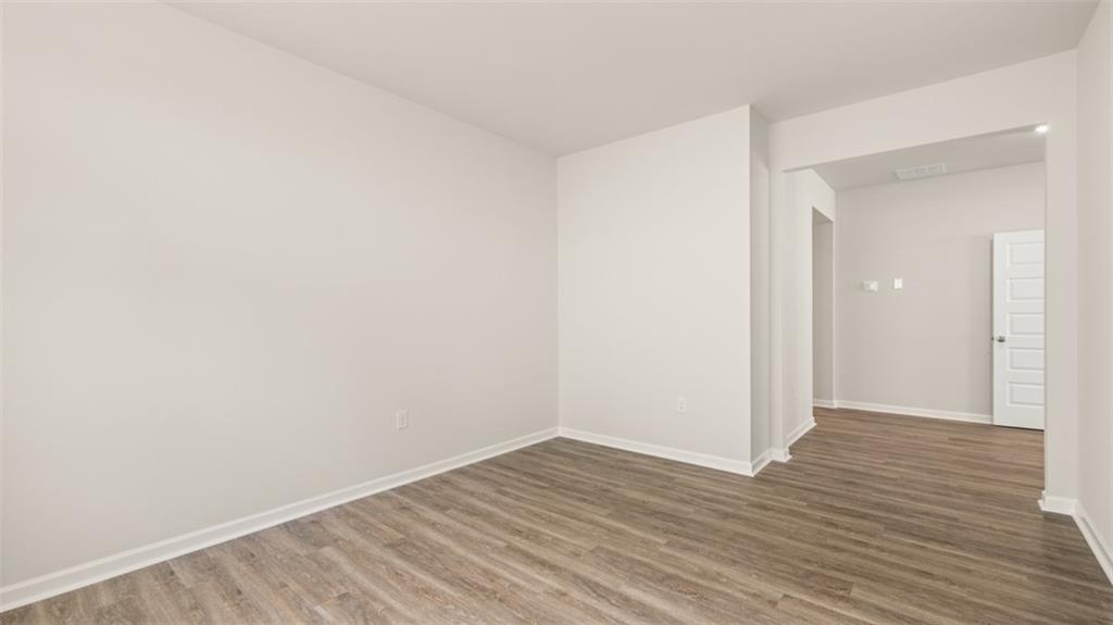 2242 Edgecombe Lane Dacula, GA 30019 - Photo 18 of 33 a view of an empty room with wooden floor