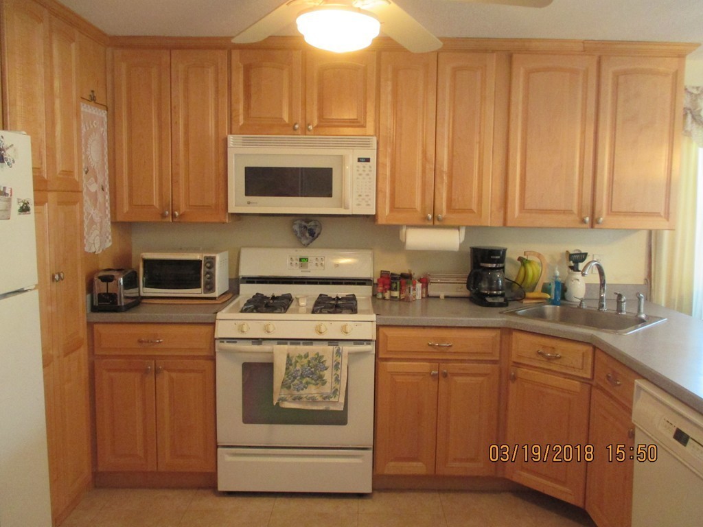 17-19 Pondover Road Billerica, MA 01821 - Photo 2 of 28 a kitchen with stainless steel appliances granite countertop a stove a sink and a white cabinets