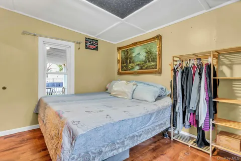 a bedroom with bunk bed and a window